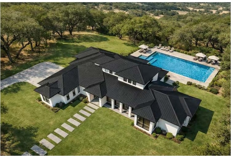 The Monaco — aerial view of the home, pool and surrounding oak-studded lot