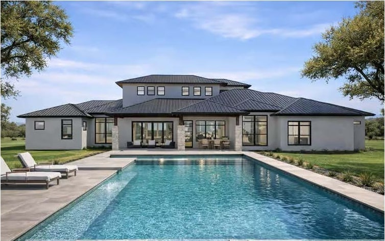 The Monaco — resort-style rear pool and covered lanai