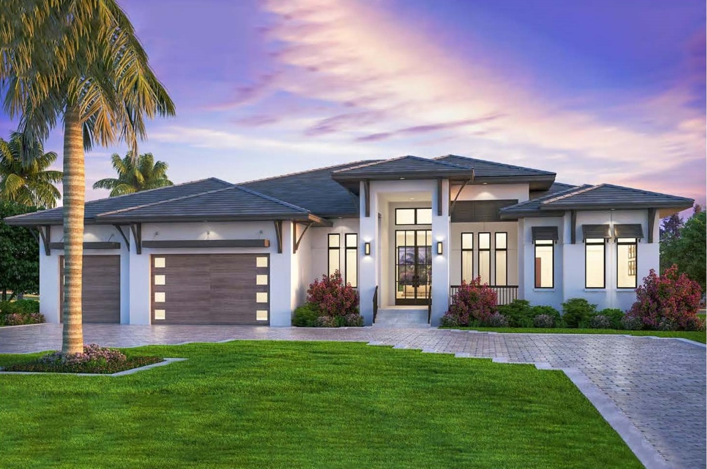 Windsor Villa — single-story estate at dusk with light stucco walls, a dark low-pitch tile roof, palm trees and a paver driveway