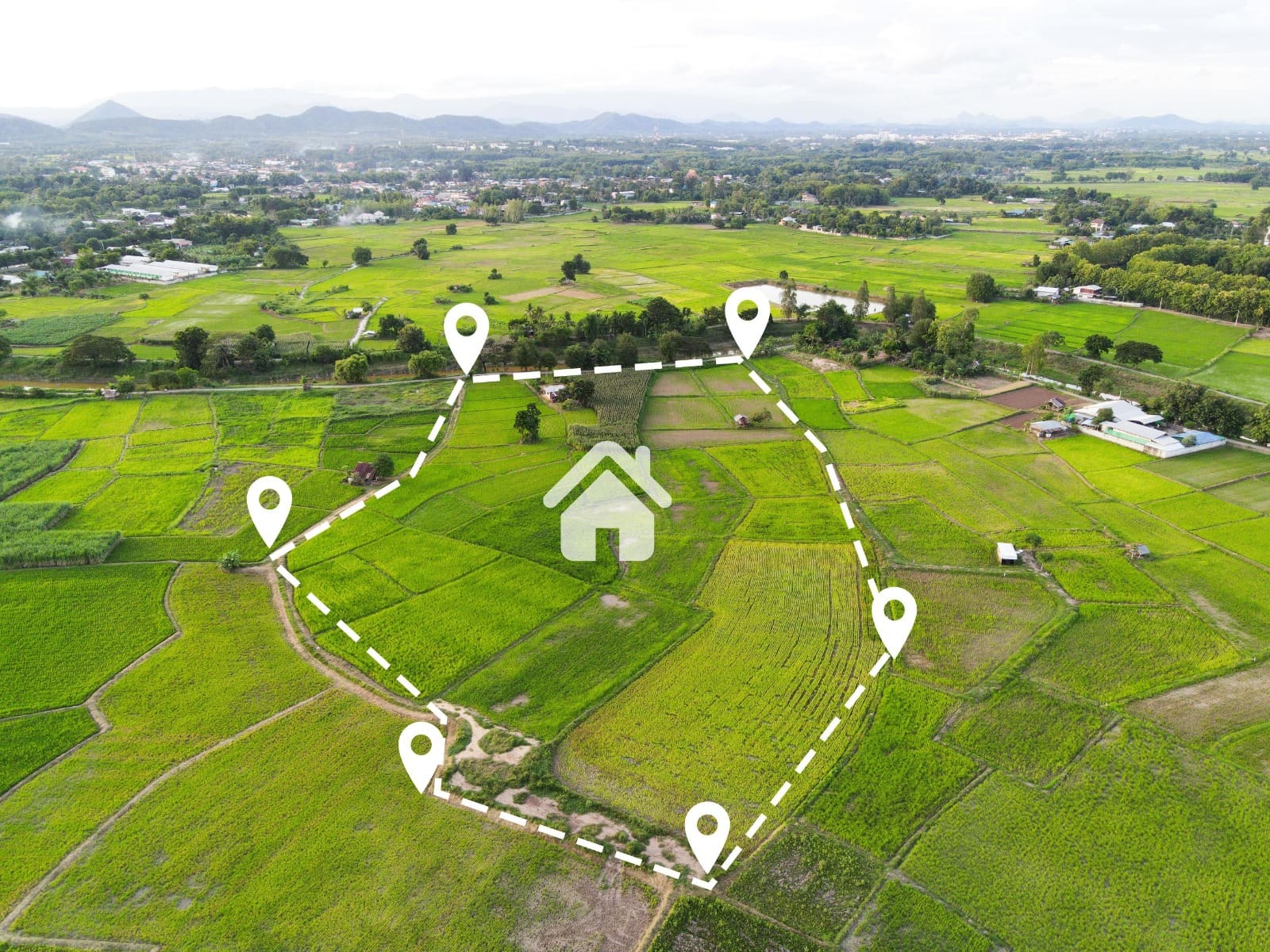 Illustrative aerial photograph of farmland with a site-boundary survey overlay — representing land and site evaluation