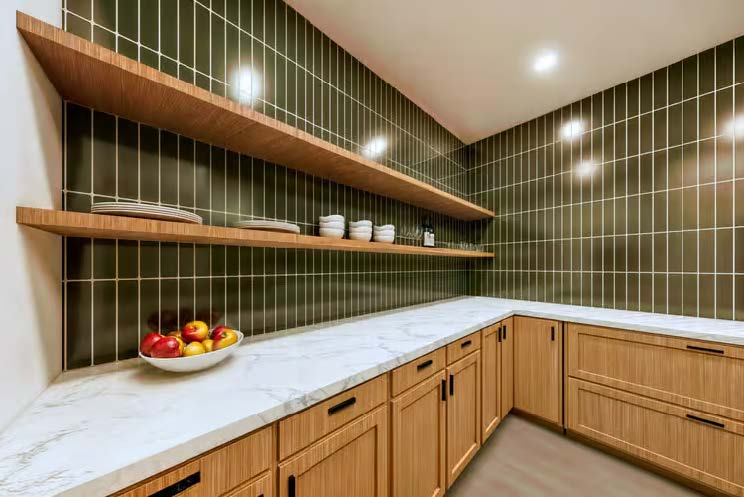 The Stallion — butler's pantry with green tile backsplash and open wood shelving