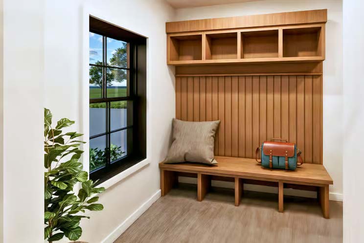 The Stallion — mudroom bench nook with wood cubbies and window