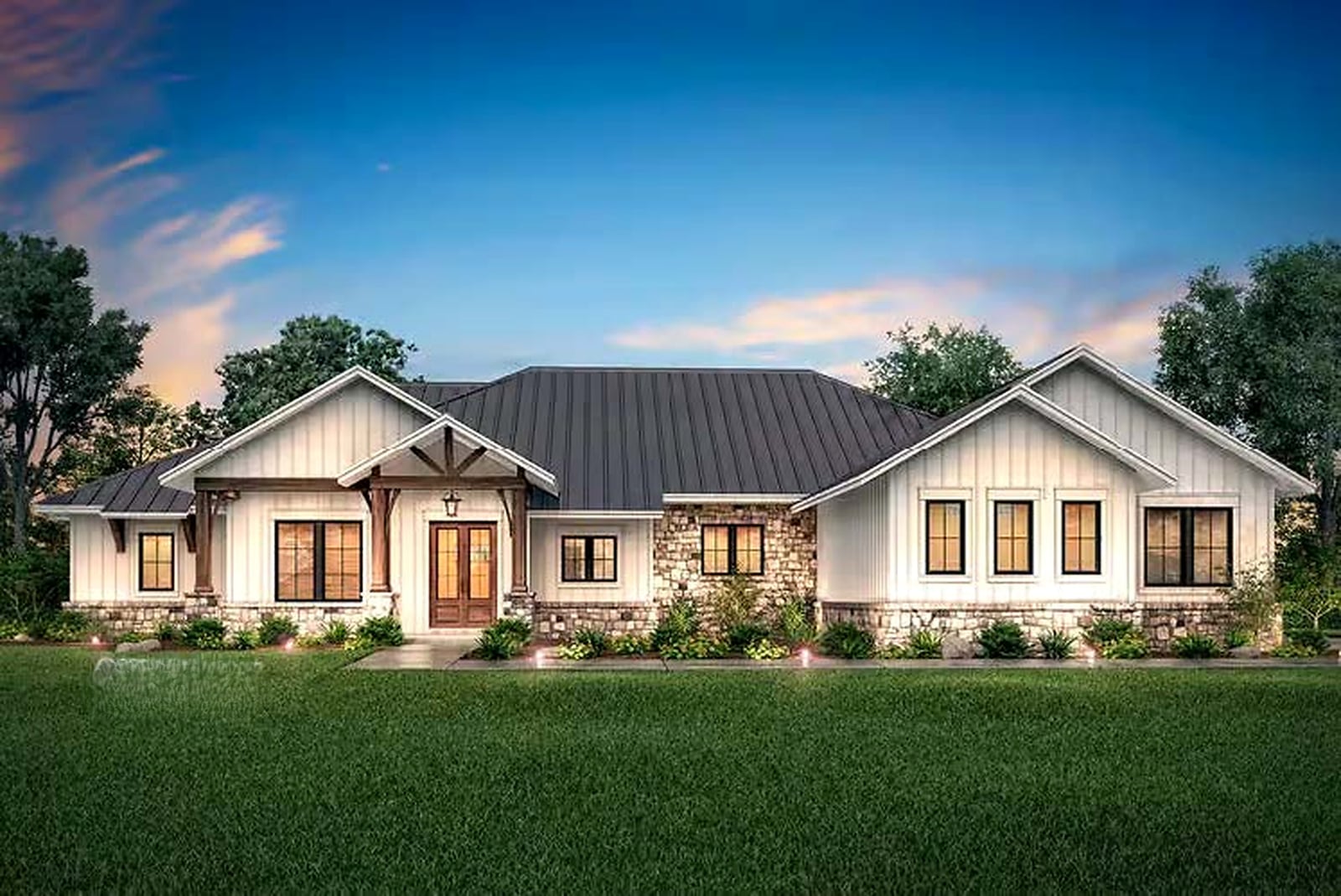 The Ashbourne — Hill Country farmhouse exterior at dusk with stone accents and a wood-beamed entry